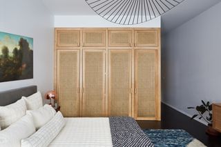 A guest bedroom with closed storage