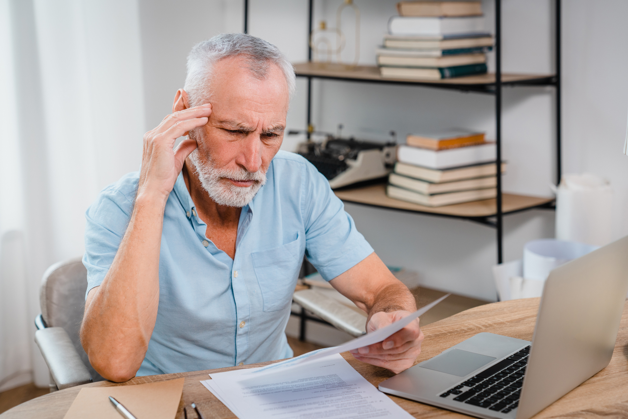 an older man weighing a decision