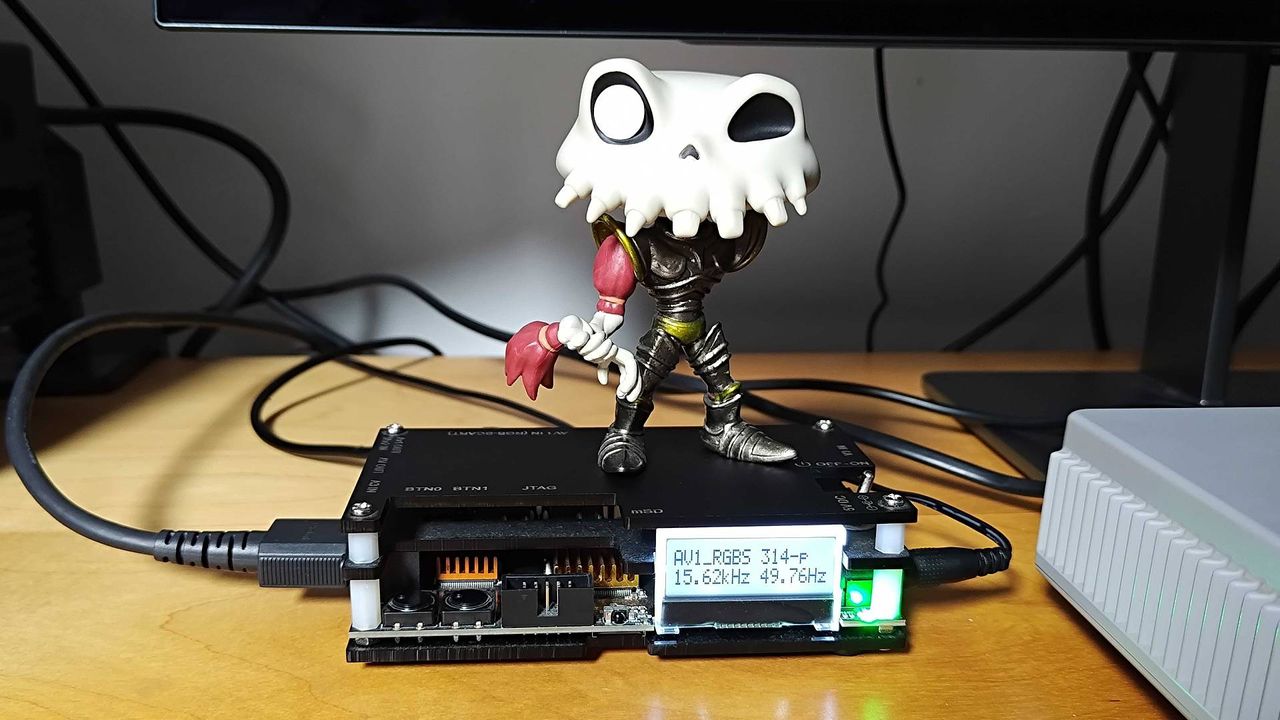 OSSC upscaler with Sir Dan MediEvil figure on top and screen illuminated with video information.
