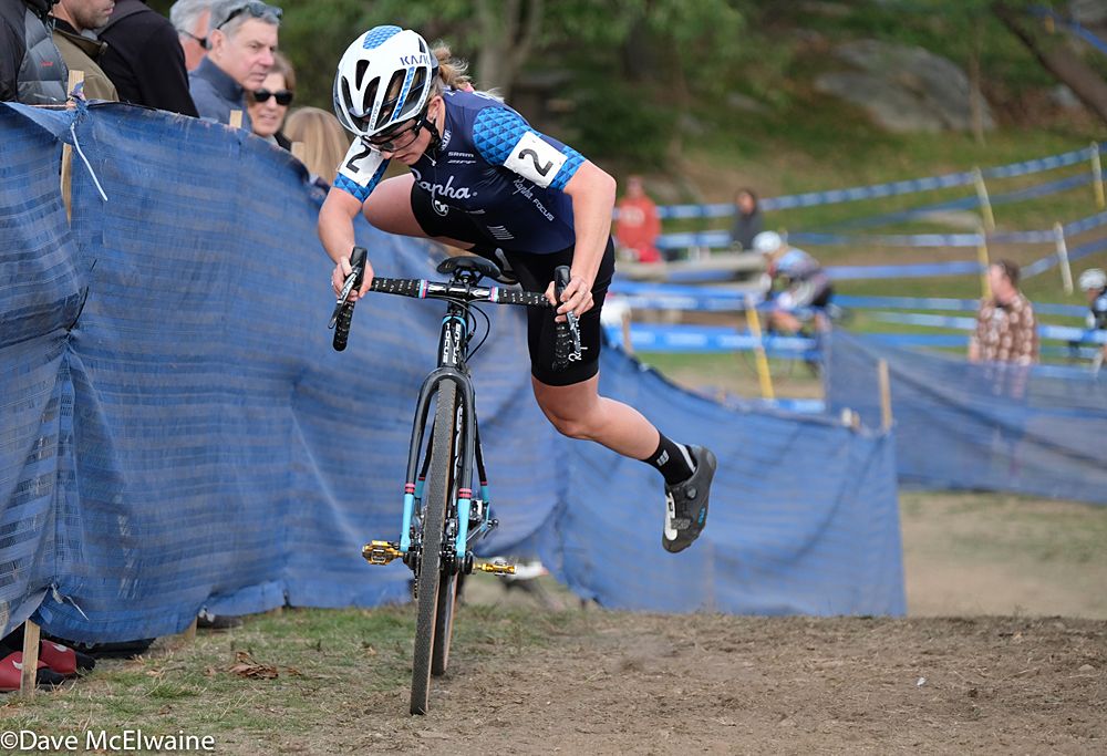 Ellen Noble (Aspire Racing) re-mounting her bike with the race lead and one lap to go