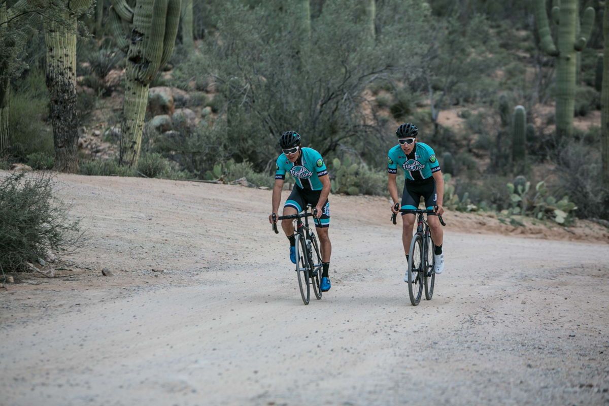 Travis McCabe and Nick Zukowsky train in the Floyd's Pro Cycling 2019 team kit