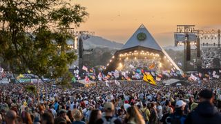 Sunset on the Glastonbury Festival at the Pyramid Stage