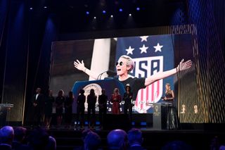 Megan Rapinoe, who was unable to except her award in person, wins the Ballon D'Or award during the Ballon D'Or Ceremony at Theatre Du Chatelet on December 02, 2019 in Paris, France. The 2019 female nominees pose onstage in her absence.