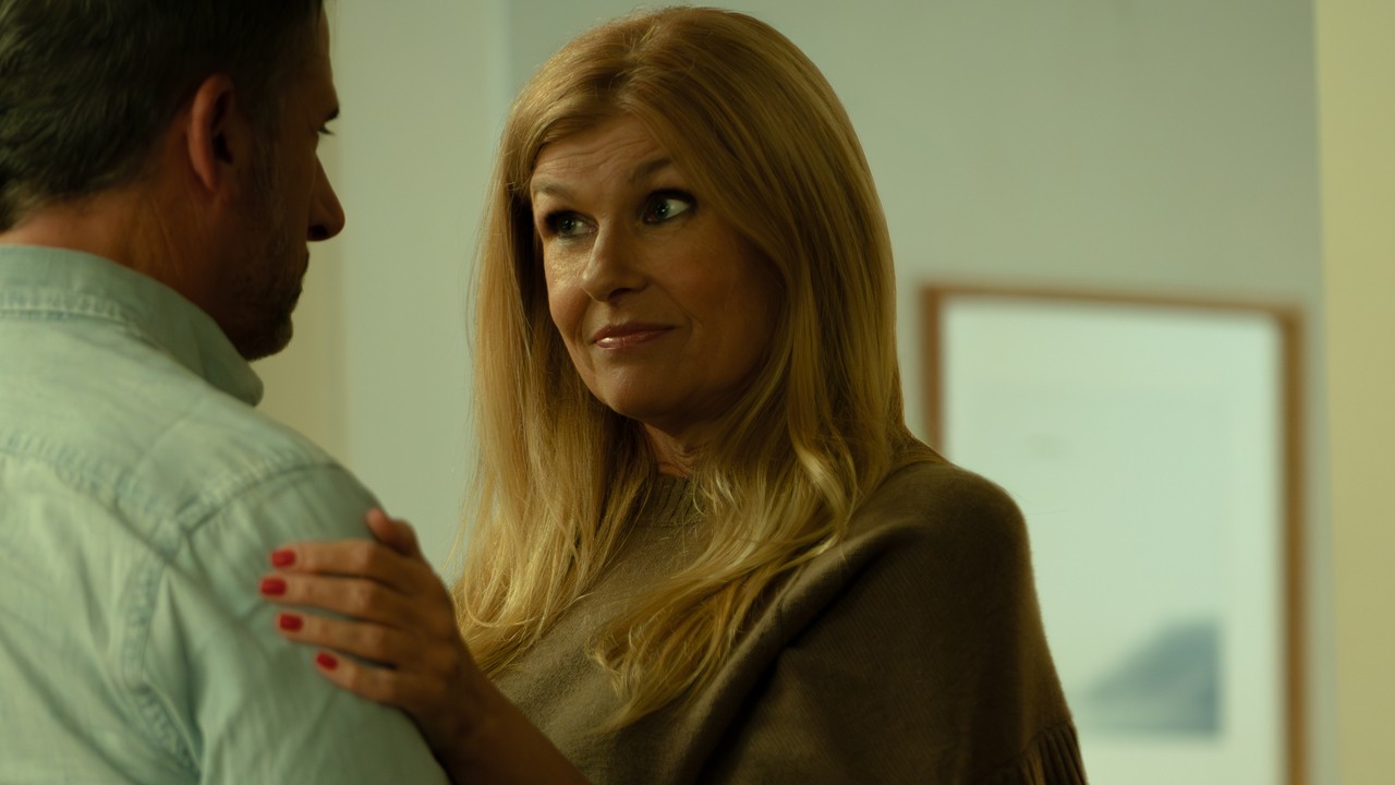 Beth putting her arm on Greg.
