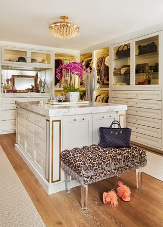 White and gold closet with island