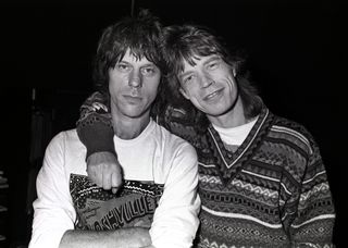 HILVERSUM, NETHERLANDS - 12th DECEMBER: Jeff Beck and Mick Jagger (right) pose together at the mixing desk in Wisseloord Studios, Hilversum, Netherlands while working on Mick Jagger's solo album, Primitive Cool on 12th December 1986.