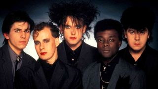 The Cure posing for a photograph in 1984