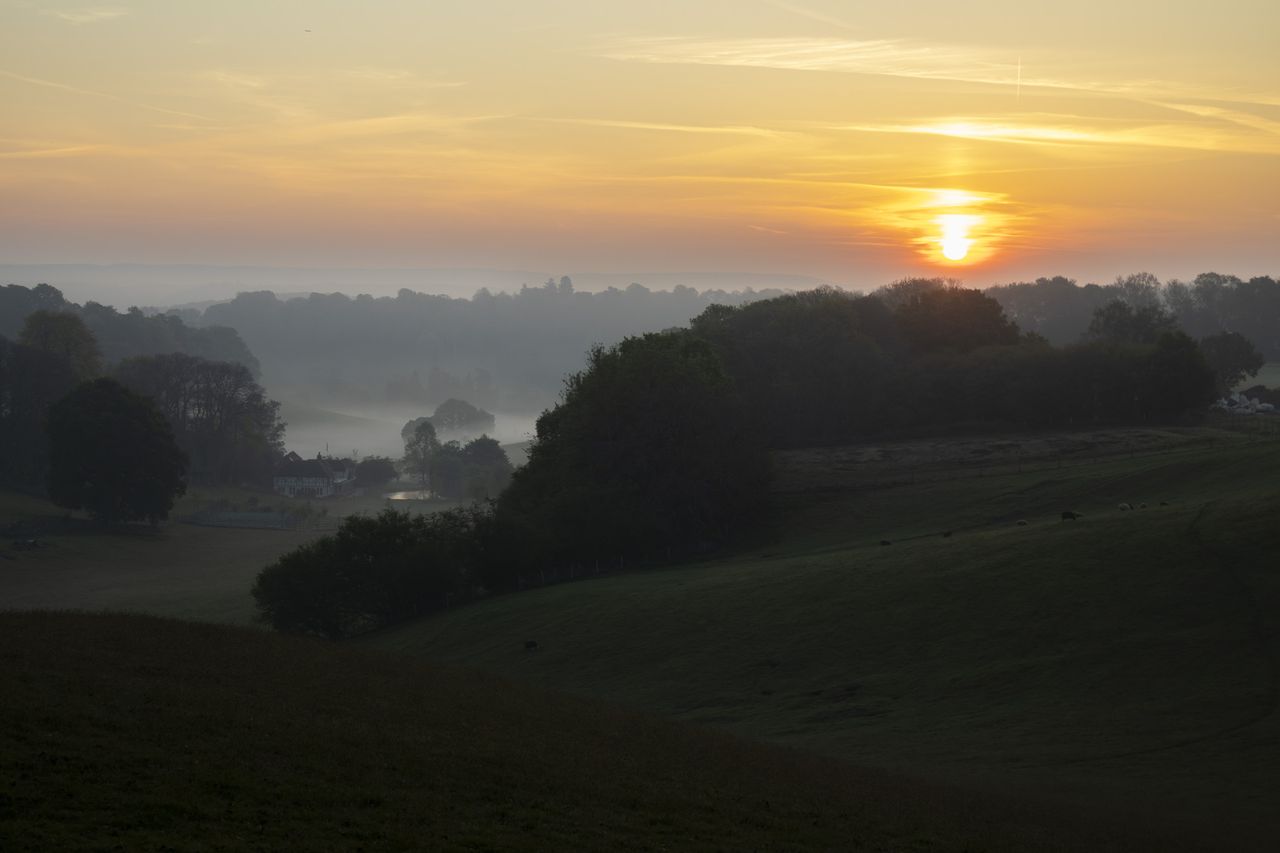 Photo of a sunrise on a misty morning, taken with the Canon EOS R100