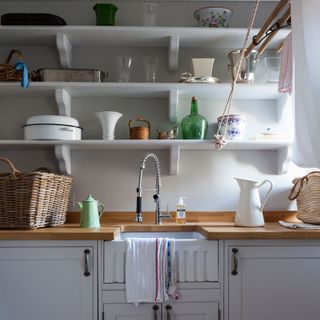 utility room with fill one wall with stacked shelves