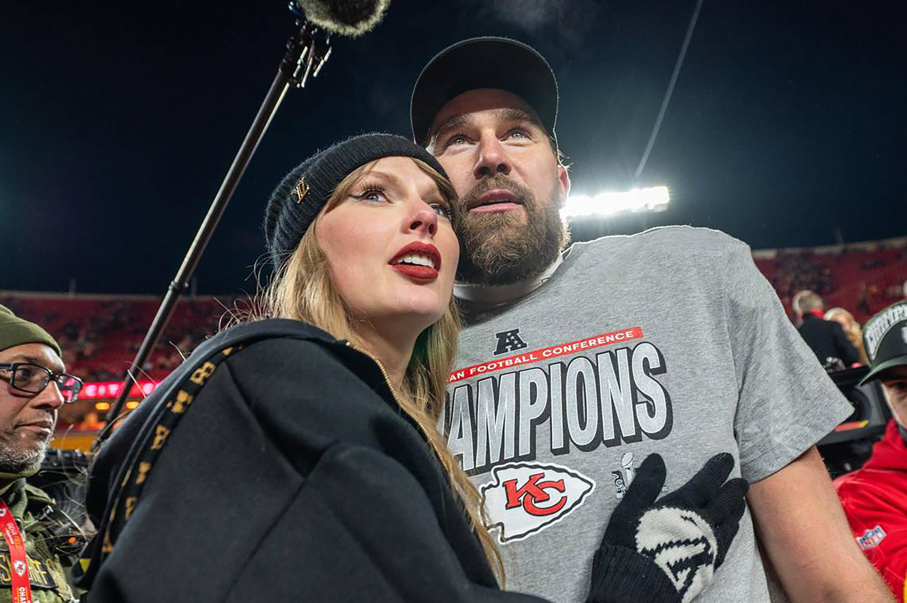 Taylor Swift, left, and Kansas City Chiefs tight end Travis Kelce walk off the field after the trophy ceremony following the Chiefs' 32-29 victory over the Buffalo Bills in the AFC Championship Game on Jan. 26, 2025, at GEHA Field at Arrowhead Stadium in Kansas City, Missouri.
