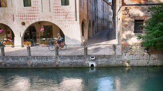 Woman cycling in Treviso
