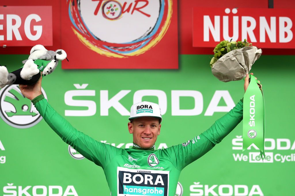 NUREMBERG GERMANY AUGUST 29 Pascal Ackermann of Germany and Team Bora Hansgrohe celebrates winning the green points jersey on the podium ceremony after the 35th Deutschland Tour 2021 Stage 4 a 1563km stage fro Erlangen to Nrnberg DeineTour on August 29 2021 in Nuremberg Germany Photo by Christian KasparBartkeGetty Images