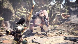 Aiming a huge bow at a T-Rex-looking Anjanath creature Monster Hunter