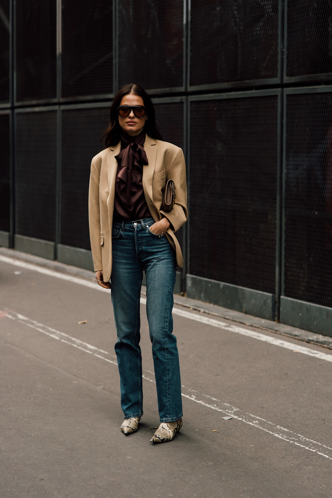 fashion week attendee wearing sunglasses, beige blazer, jeans
