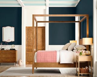 bedroom with dark blue wall and four-poster bed