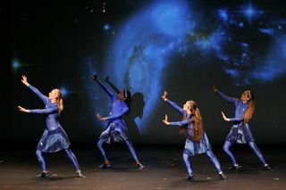 The AstroDance dancers' movements represent the birth and evolution of the universe. This relates to recent discoveries that are bringing society closer to understanding what happened soon after the Big Bang.