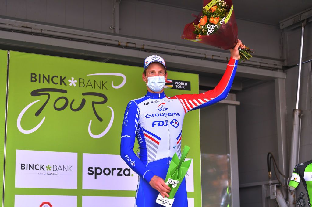 GERAARDSBERGEN BELGIUM OCTOBER 03 Podium Stefan Kung of Switzerland and Team Groupama FDJ Celebration Trophy Flowers Mask Covid safety measures during the 16th BinckBank Tour 2020 Stage 5 a 1836km stage from Ottignies Louvain la Neuve to Muur van Geraardsbergen 108m BinckBankTour BinckBankTour on October 03 2020 in Geraardsbergen Belgium Photo by Luc ClaessenGetty Images