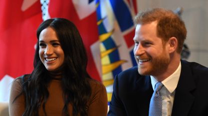 Prince Harry, Duke of Sussex and Meghan, Duchess of Sussex smile during their visit to Canada House