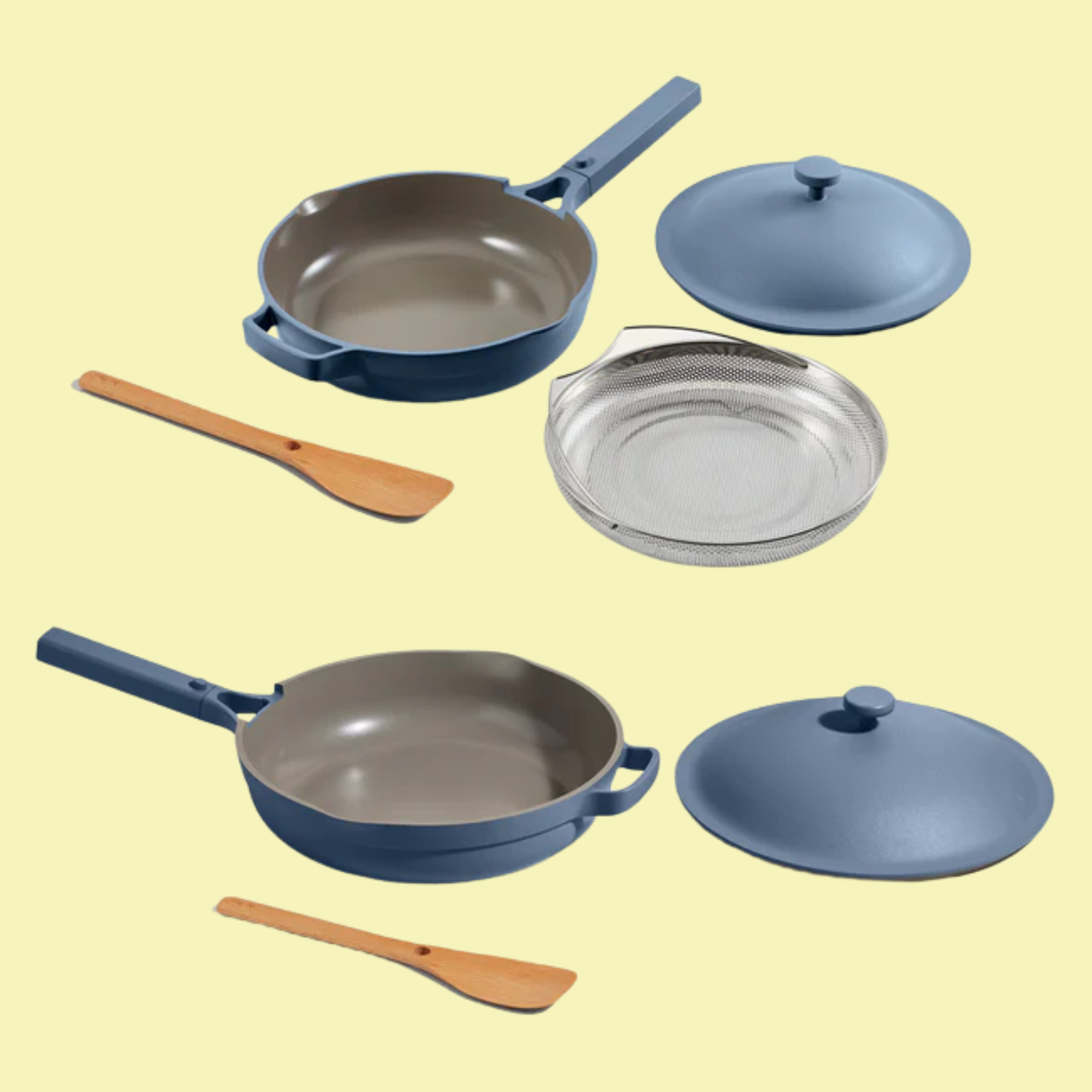 A blue cookware duo with wood spoons