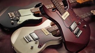 Three Yamaha electric guitars