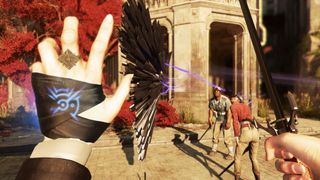 En skärmdump från Dishonored 2 som visar en magikers händer som håller på att slåss mot fiender.
