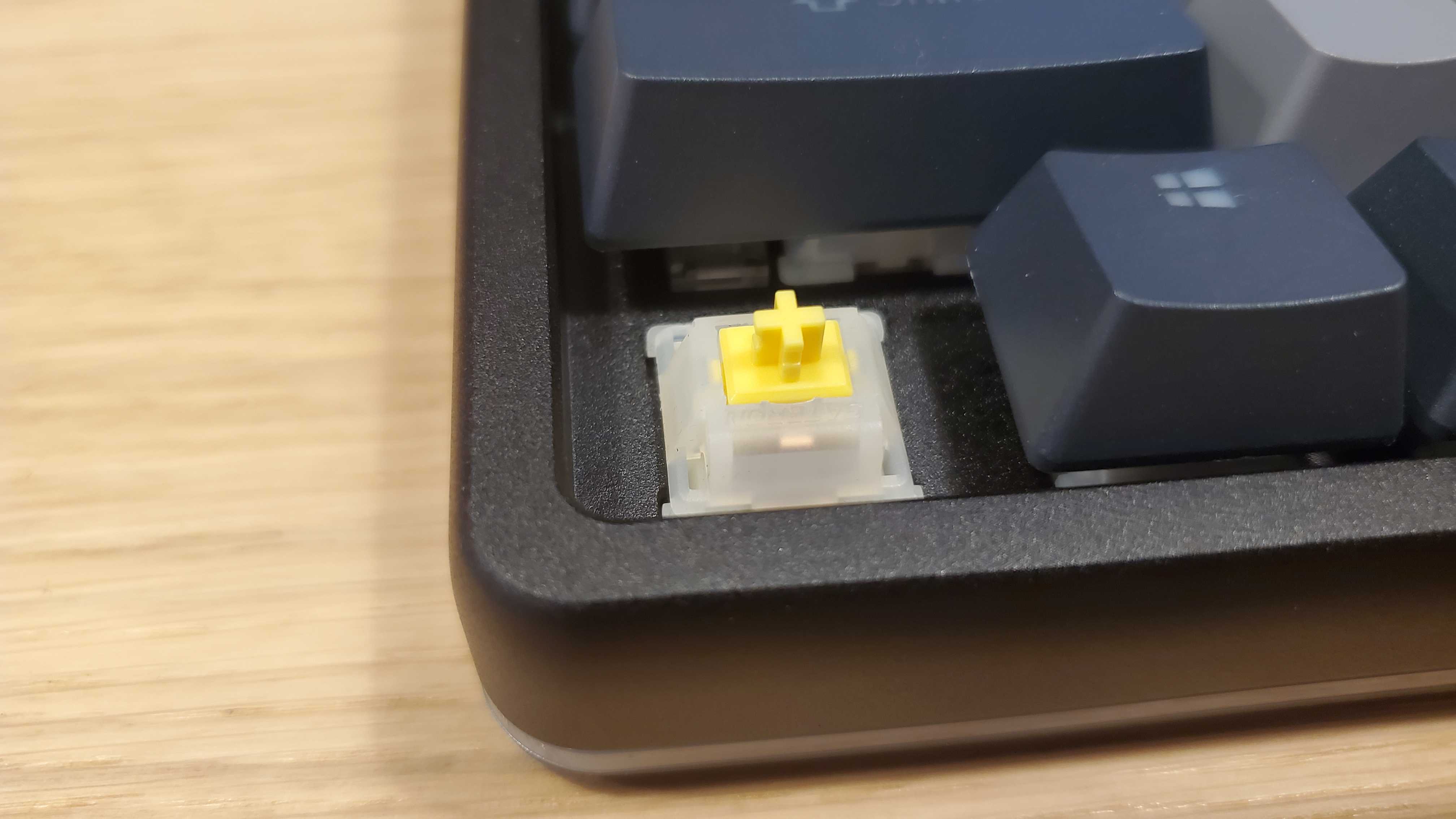 yellow switch of black and grey keyboard