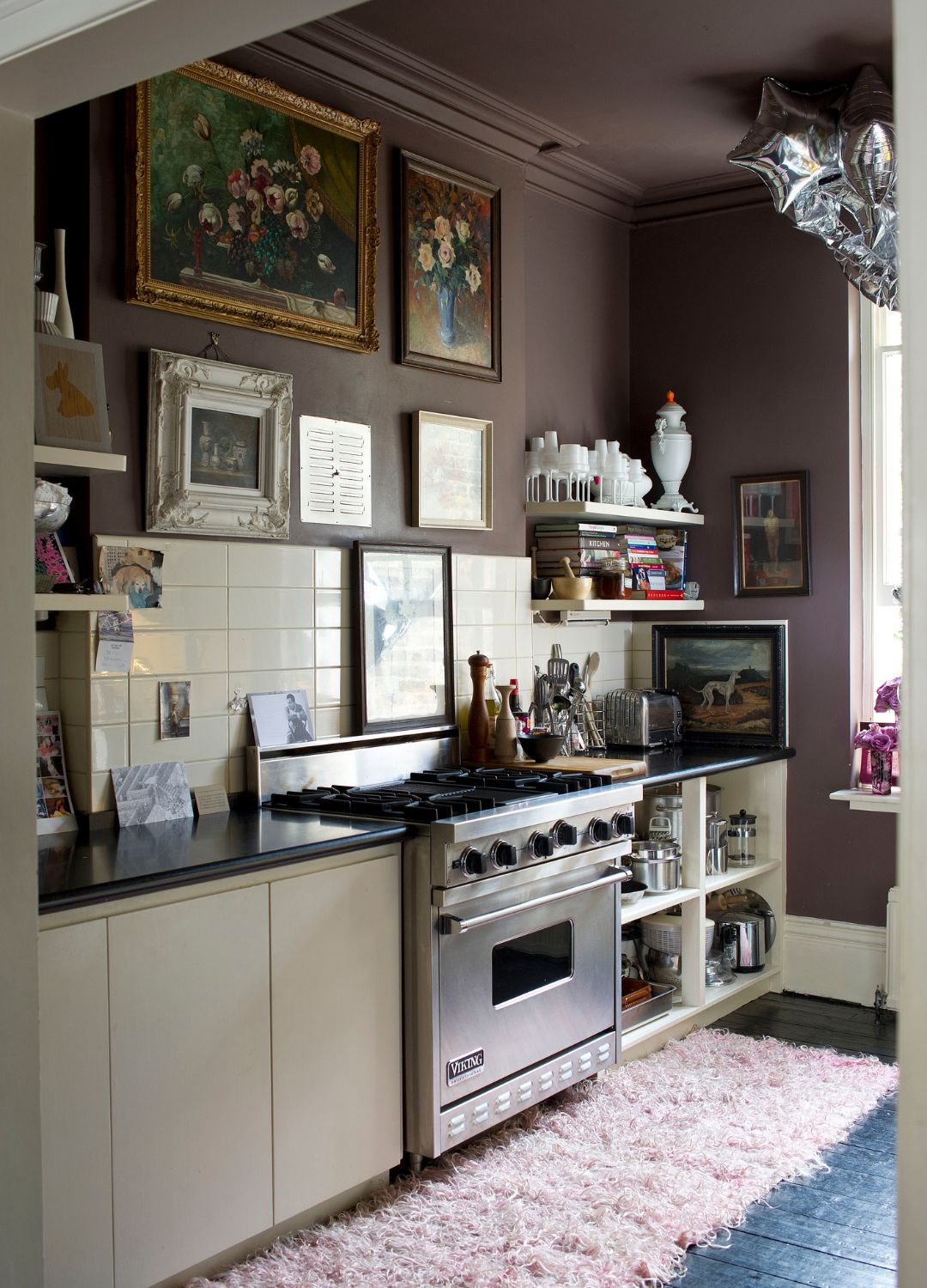 picture of brown painted kitchen with white cupboards and frame paintings