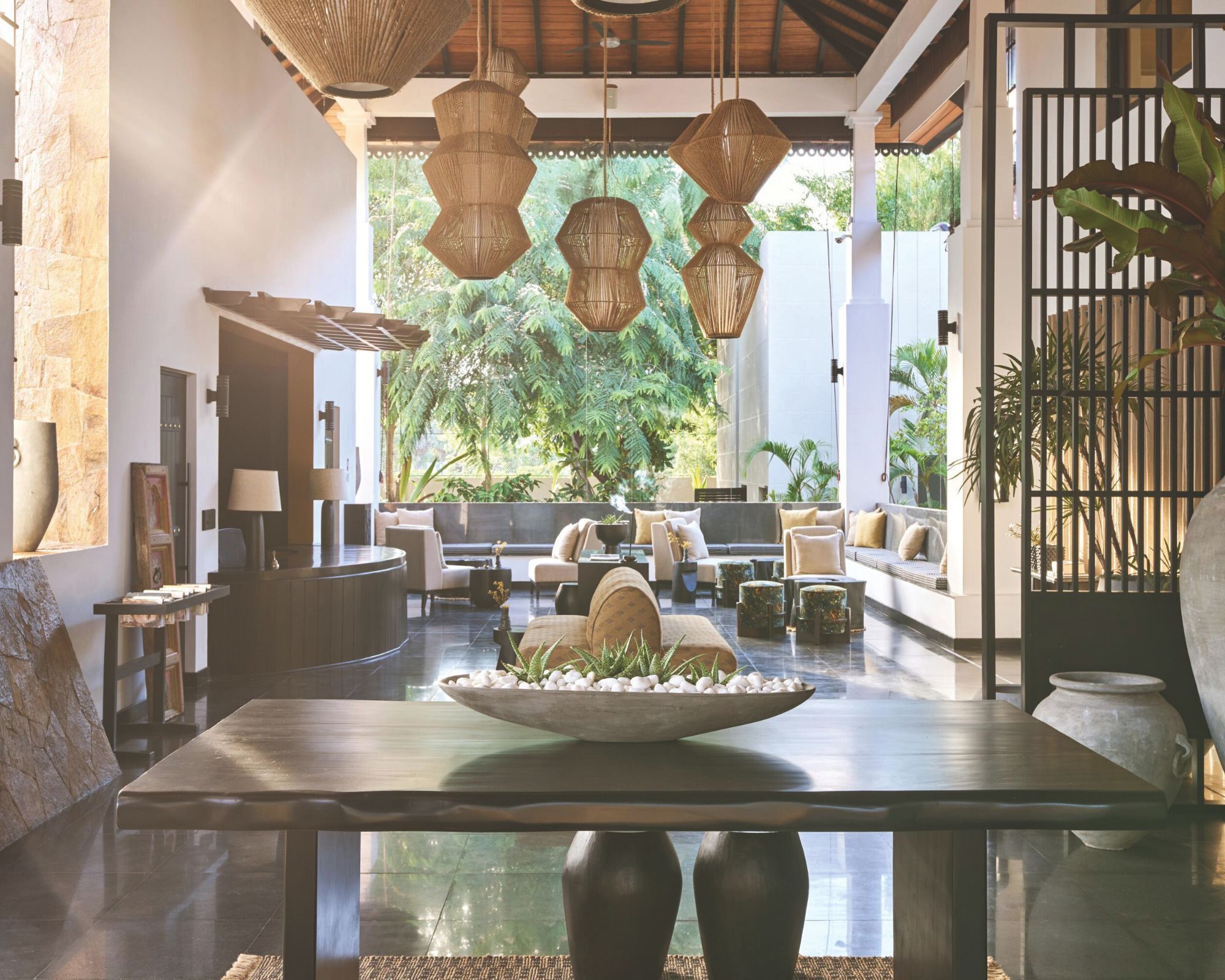 Hotel lobby with black gloss tile floors and lantern lights