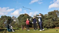 A player throws a club in anger