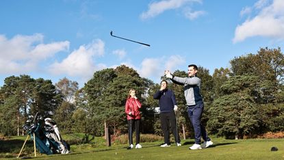 A player throws a club in anger