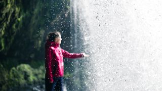 Hiker behind Sgwd yr Eira, Wales