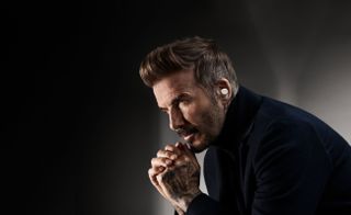 David Beckham wearing a pair of Bowers & Wilkins Pi8 headphones