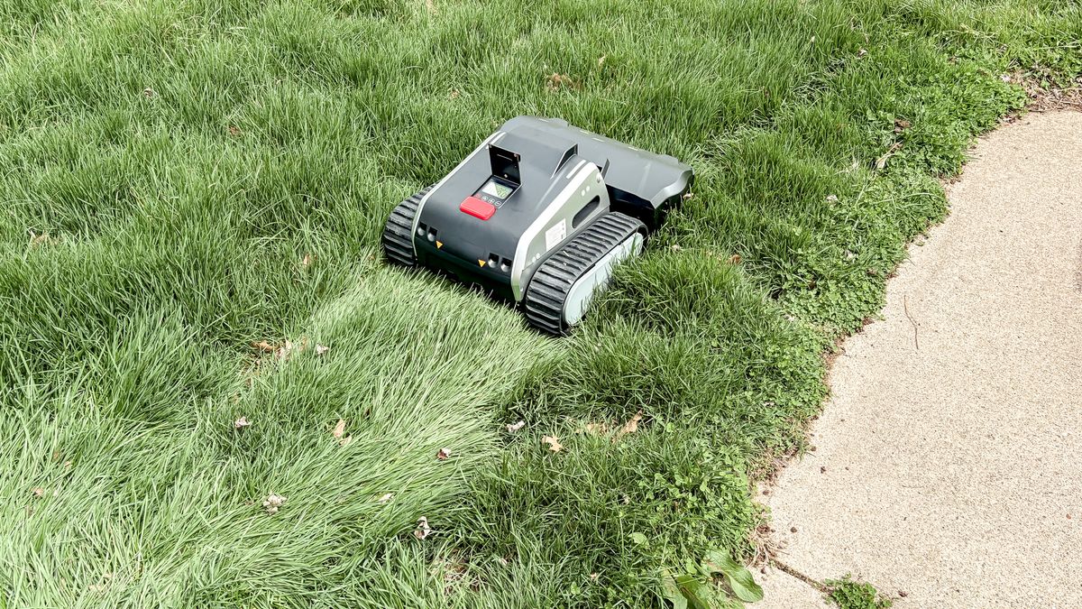 Lymow One Plus robot mower on a lawn