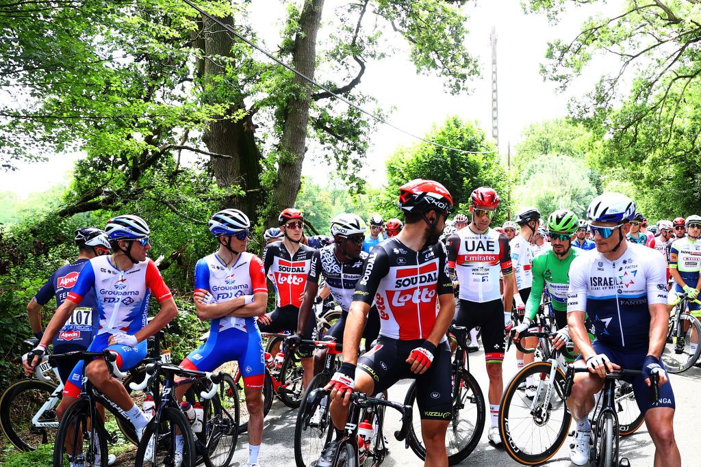 FOUGERES FRANCE JUNE 29 Thomas De Gendt of Belgium and Team Lotto Soudal Andr Greipel of Germany and Team Israel StartUp Nation The peloton protest due to lack of safety and multiple crashes during the 108th Tour de France 2021 Stage 4 a 1504km stage from Redon to Fougres LeTour TDF2021 on June 29 2021 in Fougeres France Photo by Michael SteeleGetty Images