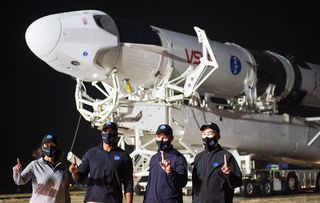 NASA astronauts Shannon Walker, Victor Glover and Mike Hopkins and Japanese astronaut Soichi Noguchi visit their Crew-1 SpaceX Crew Dragon capsule, dubbed "Resilience," on Nov. 9, 2020.