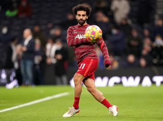 Liverpool’s Mohamed Salah warming up prior to kick-off before the Premier League match at the Tottenham Hotspur Stadium, London. Picture date: Sunday December 19, 2021