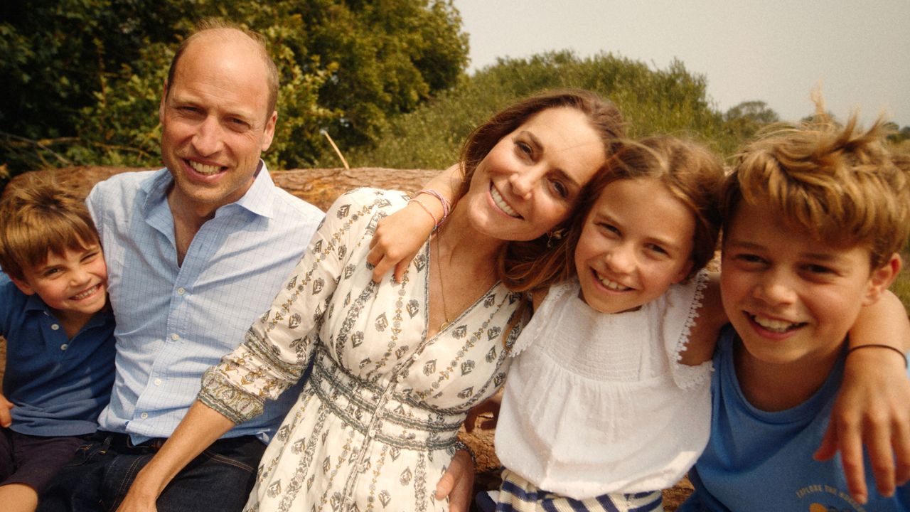 Kate Middleton, Prince Louis, Prince George, Princess Charlotte and Prince William hugging in the woods