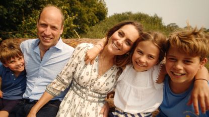 Kate Middleton, Prince Louis, Prince George, Princess Charlotte and Prince William hugging in the woods