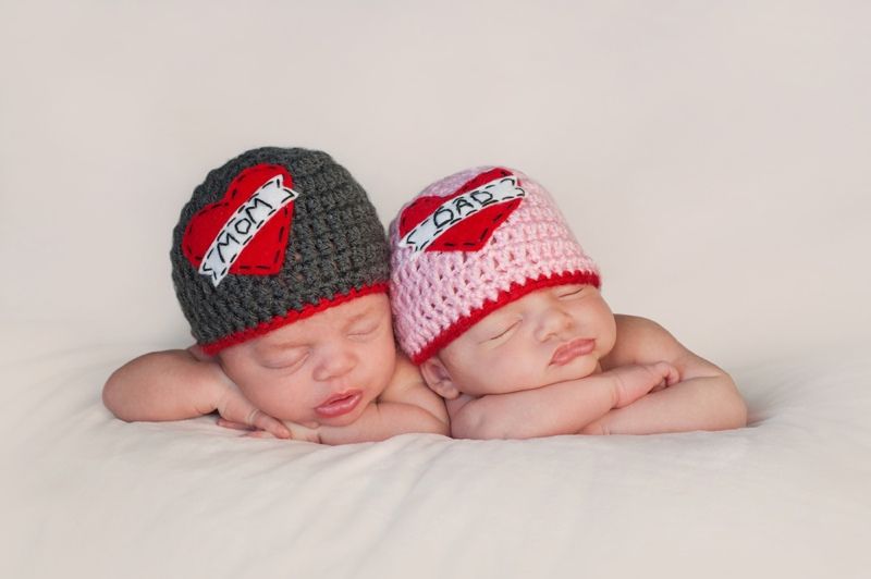 Five week old sleeping boy and girl fraternal twin newborn babies. 