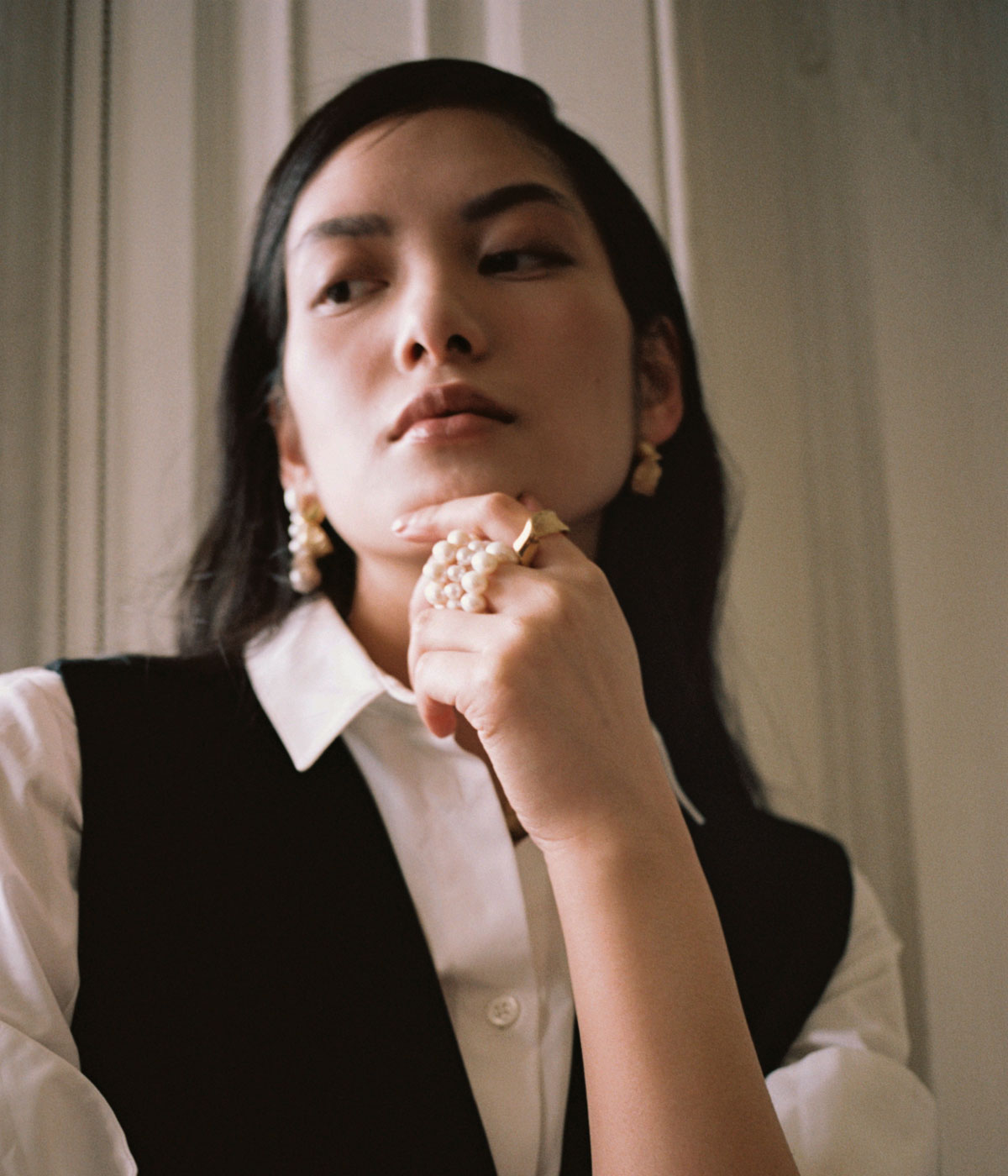 woman wearing Completedworks jewellery