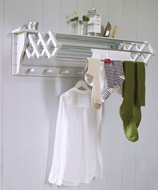 cox and cox wall mounted extendable clothes dryer on a wall