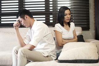 A young man and woman arguing.