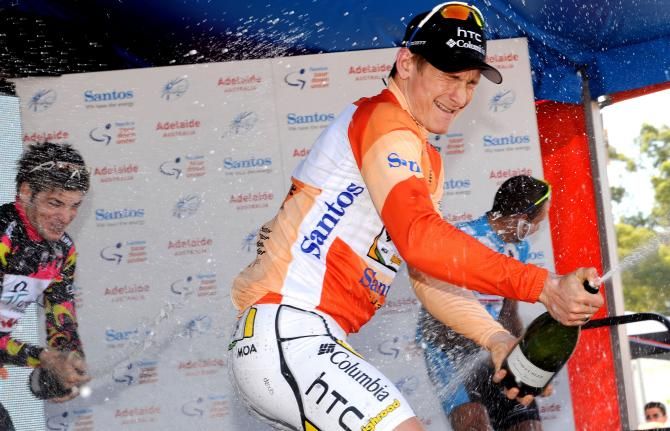 Andr&eacute; Greipel sprays the champagne