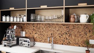 cork splashback in modern black kitchen