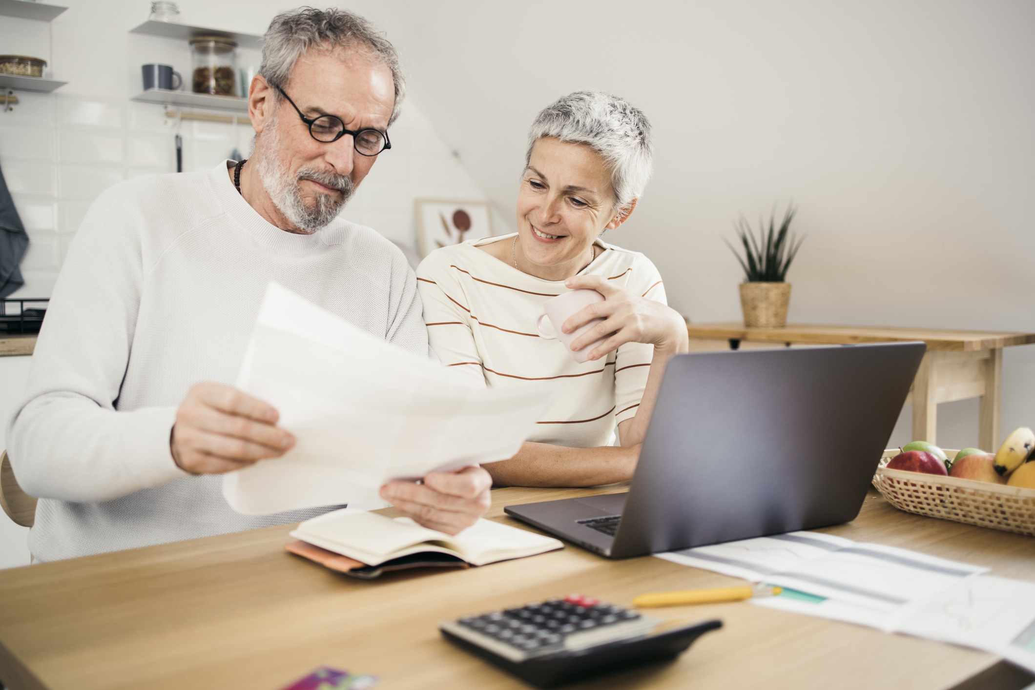 Man and woman managing their life insurance policy.