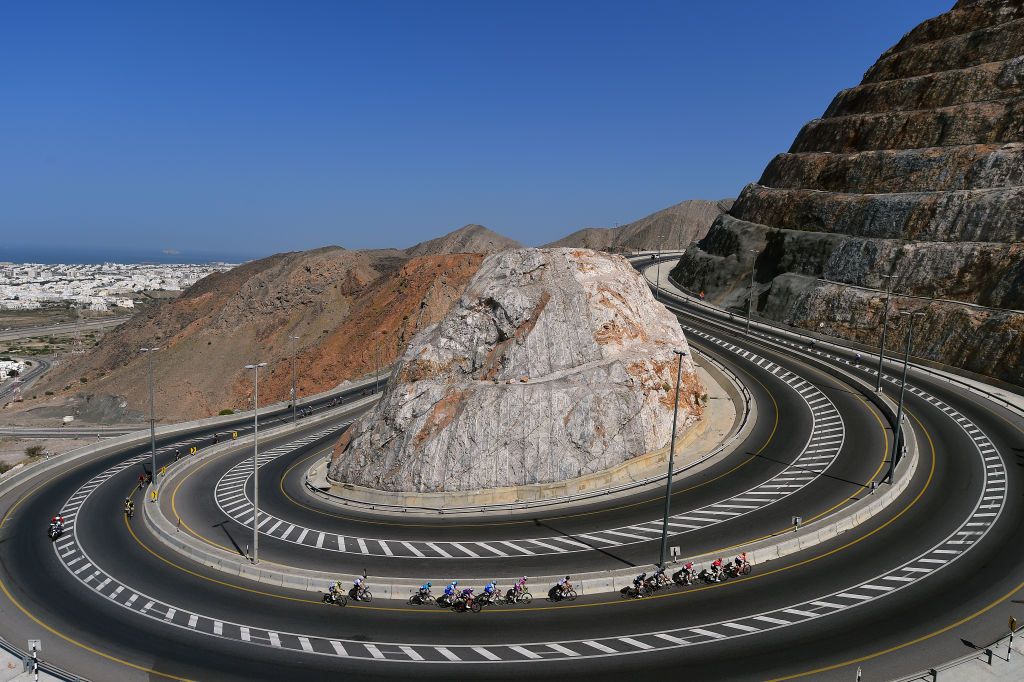 MUSCAT OMAN FEBRUARY 13 A general view of the peloton passing through Al Jabal Street Bousher Al Amerat 355m during the 11th Tour Of Oman 2022 Stage 4 a 1195km stage from Al Sifah to Mucat TourofOman on February 13 2022 in Muscat Oman Photo by Dario BelingheriGetty Images