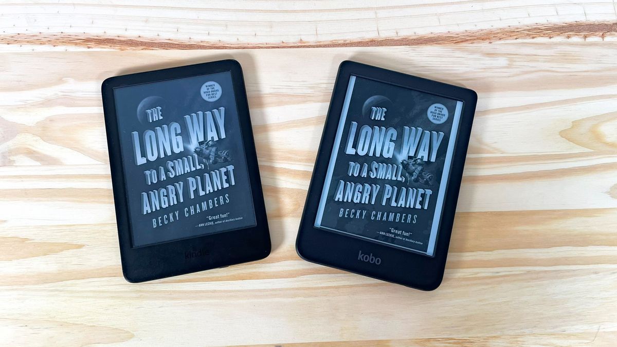 An Amazon Kindle and Kobo Clara BW side by side on a wood table showing the same book cover