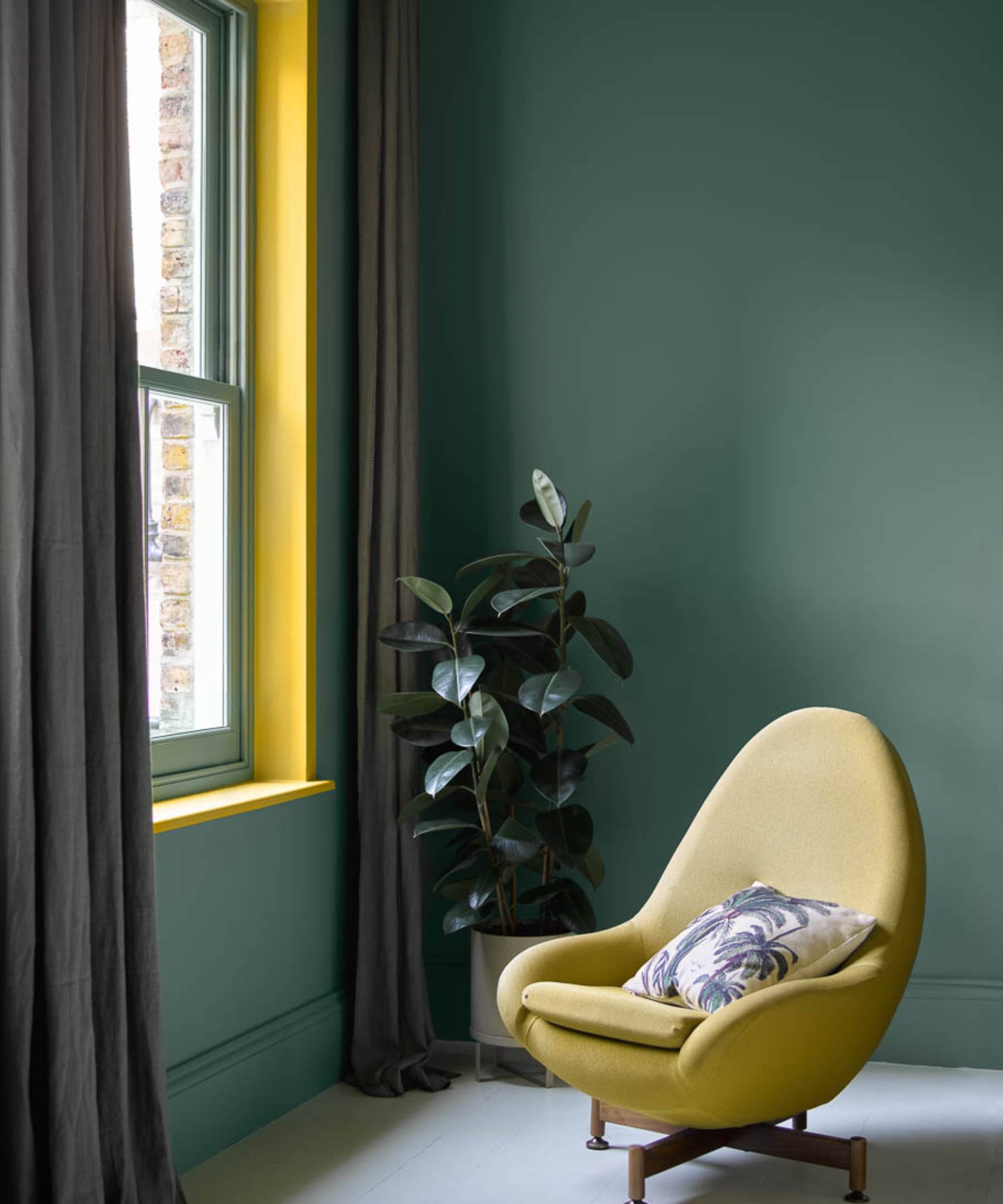 living room with window reveal painted yellow, walls painted green