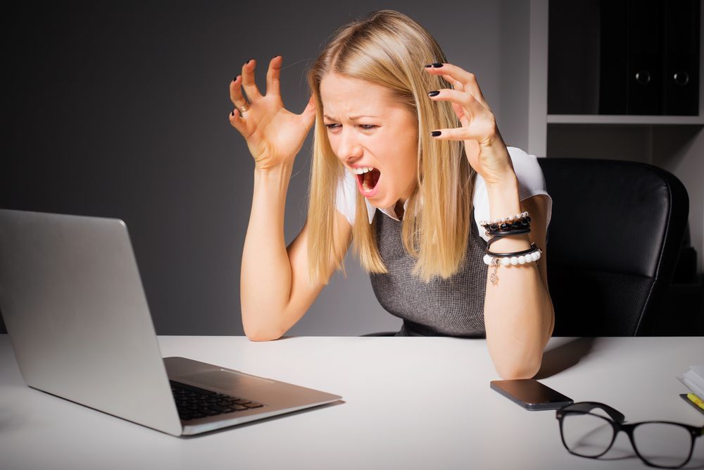 Woman angry at computer