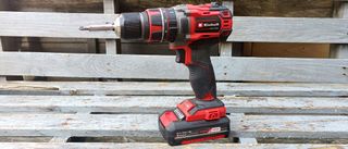 Einhell cordless drill on wooden bench